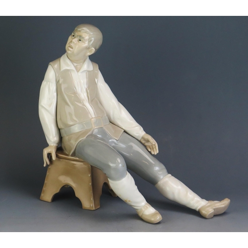 1791 - A Lladro porcelain figure of Sancho Panza, lacking hat, on a velvet lined plinth, 27cm high, 29cm lo... 