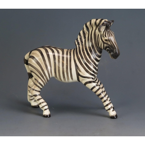 1795 - A Beswick pottery model of a Zebra, 17.5cm high, 18cm long.