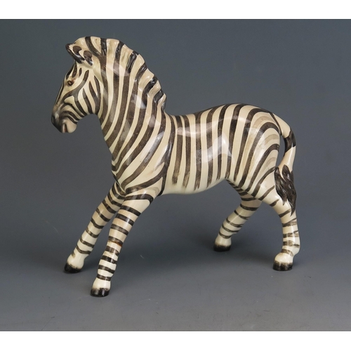 1795 - A Beswick pottery model of a Zebra, 17.5cm high, 18cm long.