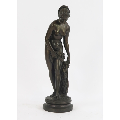 1816 - A reproduction bronze study of Venus, raised on a circular base, unsigned. 36cm high.