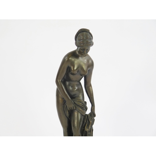 1816 - A reproduction bronze study of Venus, raised on a circular base, unsigned. 36cm high.