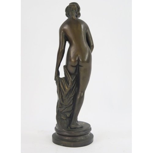 1816 - A reproduction bronze study of Venus, raised on a circular base, unsigned. 36cm high.