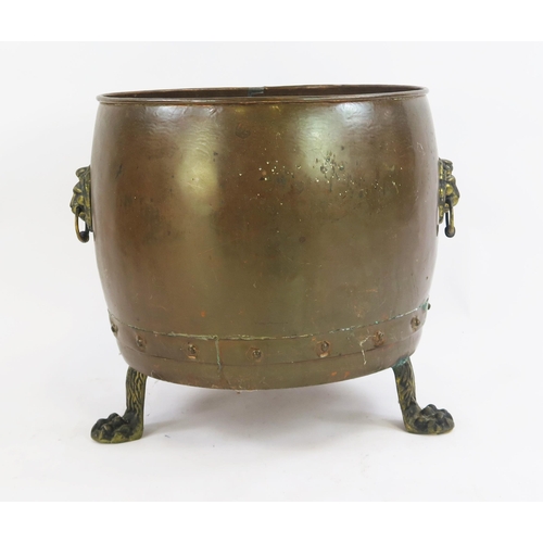 1817 - A large copper log cauldron, raised on three paw feet, 42cm high, 41cm diameter.