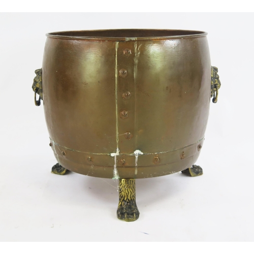 1817 - A large copper log cauldron, raised on three paw feet, 42cm high, 41cm diameter.