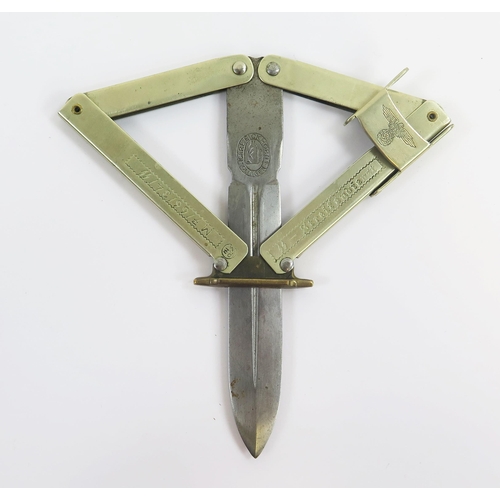 1818 - A reproduction WW2 paratroopers knife with folding scissor action, with 10cm blade, overall length 2... 