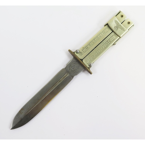 1818 - A reproduction WW2 paratroopers knife with folding scissor action, with 10cm blade, overall length 2... 