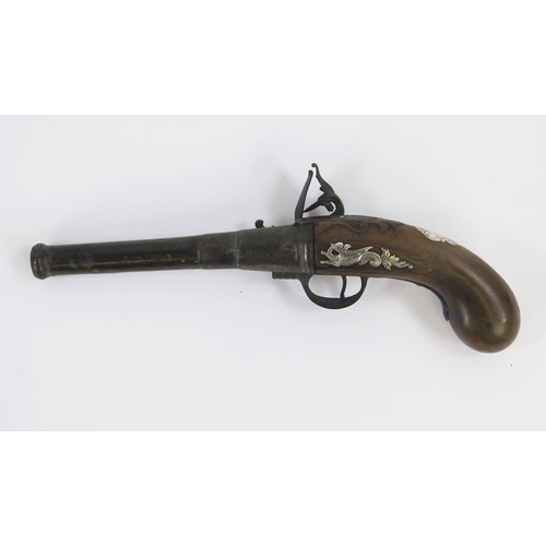 1827 - An 18th century flintlock pistol with 17cm barrel, silver mounted grip, lacks ramrod, overall length... 