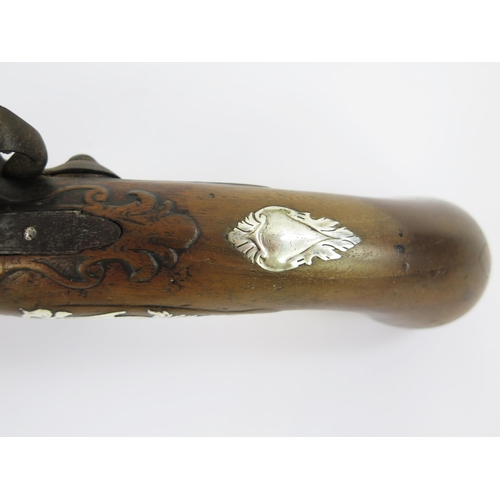 1827 - An 18th century flintlock pistol with 17cm barrel, silver mounted grip, lacks ramrod, overall length... 