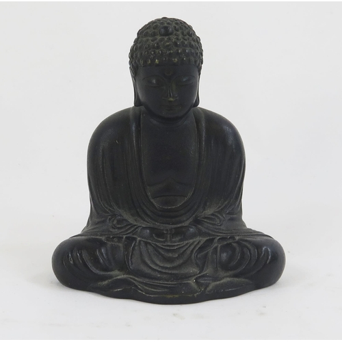 1842 - An oriental bronze figure of a seated Buddha, dressed in traditional robes, 9.5cm high