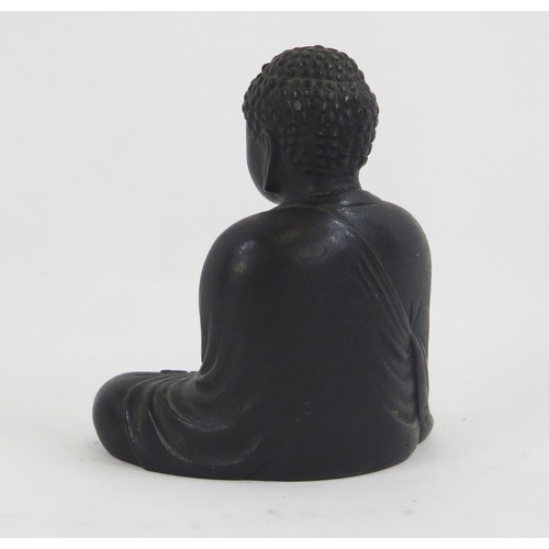 1842 - An oriental bronze figure of a seated Buddha, dressed in traditional robes, 9.5cm high