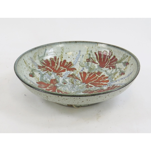 1851 - A Colin Kellam, pottery charger, with floral decoration to a pale green ground, impressed mark, 41cm... 