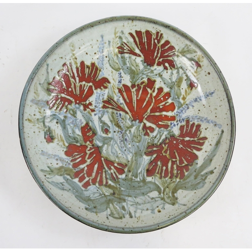 1851 - A Colin Kellam, pottery charger, with floral decoration to a pale green ground, impressed mark, 41cm... 