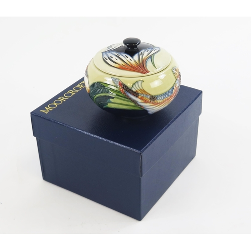 1863 - A Moorcroft pottery bowl and cover in Quiet waters pattern, to a cream ground, 14cm diameter. boxed.