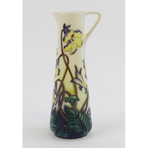 1866 - A Moorcroft pottery jug, with piped floral decoration, 19cm high, boxed.