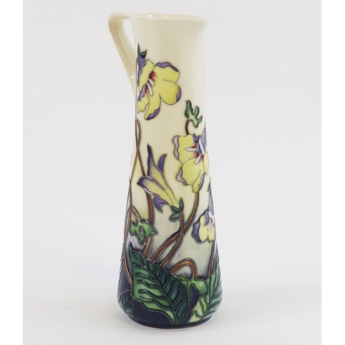 1866 - A Moorcroft pottery jug, with piped floral decoration, 19cm high, boxed.