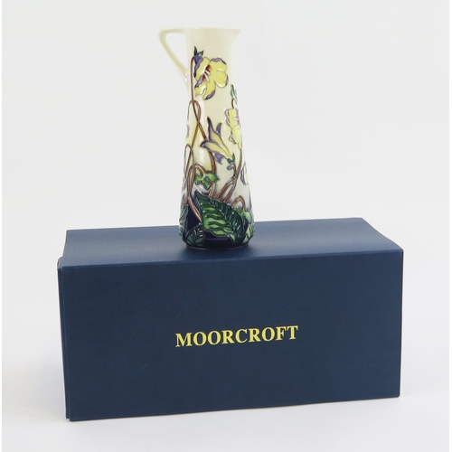 1866 - A Moorcroft pottery jug, with piped floral decoration, 19cm high, boxed.