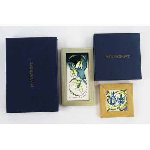 1866A - A Moorcroft pottery panel snowdrop pattern, in a silvered frame, 20.5 x 9.5cm. and a Moorcroft Willi... 