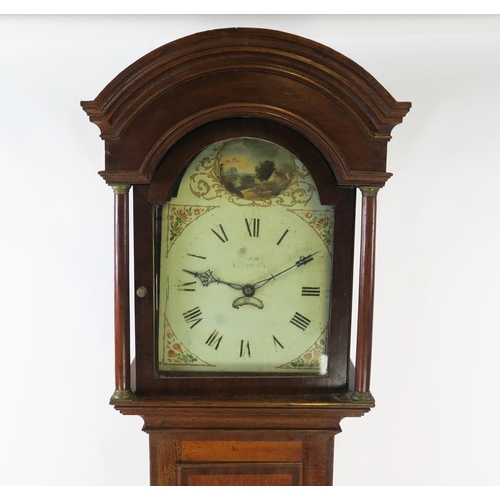 1892A - A 19th century oak longcase clock, the arched hood with turned columns, the trunk with cross banded ... 