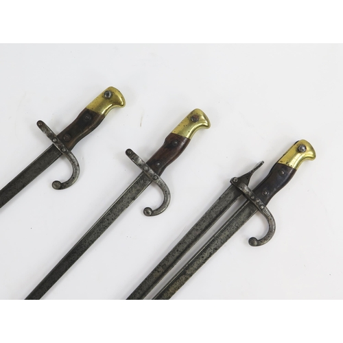 1893 - A set of three steel fire irons made from 19th century Chassepot bayonets.