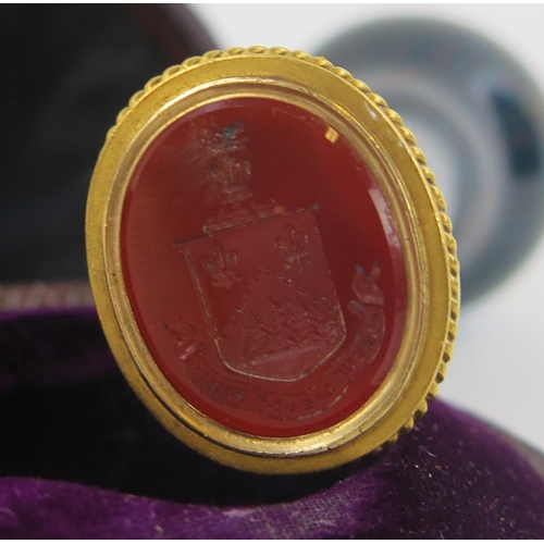 1920 - A Victorian gilt metal and bloodstone desk seal, the carved matrix with shield crest, 9cm long, in f... 