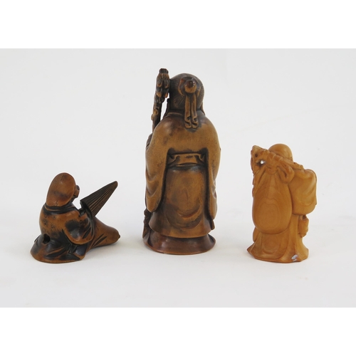 1923 - A carved boxwood netsuke in the form of hotei, signed, 5cm high, another netsuke of a man with a par... 