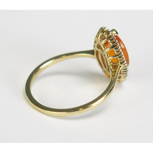 281 - A 2-5ct fire opal and diamond set marquise ring in 9ct mount, size 0, 2.4gms.