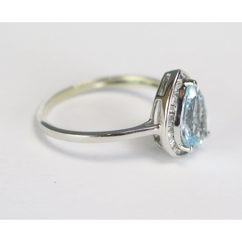 283 - An aquamarine and diamond pear-shaped ring on an unmarked white metal mount, size N/N.5