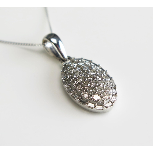 290 - A diamond encrusted oval pendant, in 9ct white gold mount and chain, length of chain 225mm.