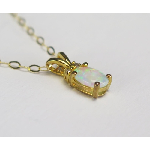 296 - An opal and diamond set pendant mounted in a 9ct gold mount and chain, length of chain 222mm.