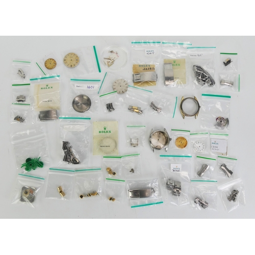 185 - A Selection of ROLEX Parts including bracelets, cases, dials, crowns, hands, etc.