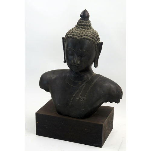 1760 - A South East Asian  bronze torso of Buddha, mounted on a rectangular plinth base, overall height 63c... 