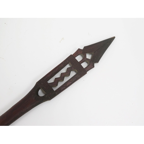 1775 - A West African tribal ceremonial carved wood spear-shaped paddle, the blade decorated with geometric... 