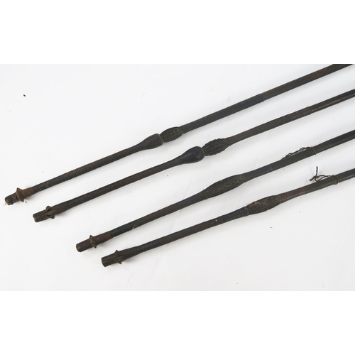 1776 - Four native spears, with double edged blades on slender carved wood shafts, overall lengths 155cm.  ... 