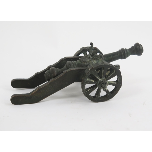 1789 - A bronze model of a cannon with 13cm barrel, the carriage mounted on spoke wheels. overall length 26... 