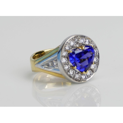 11 - An Impressive Heart Cut Tanzanite and Diamond Cluster Ring in an 18ct yellow and white gold setting,... 