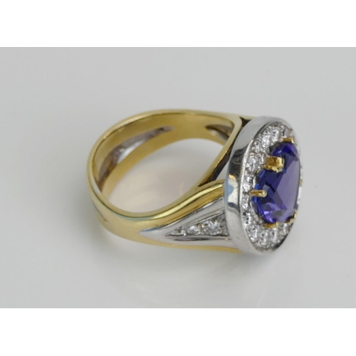 11 - An Impressive Heart Cut Tanzanite and Diamond Cluster Ring in an 18ct yellow and white gold setting,... 