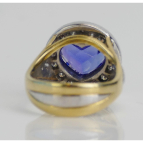 11 - An Impressive Heart Cut Tanzanite and Diamond Cluster Ring in an 18ct yellow and white gold setting,... 