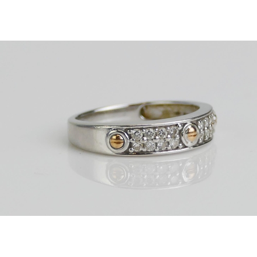 113 - An 18ct White and Yellow Gold and Diamond Two Row Half Eternity Ring with faux screw decoration, siz... 