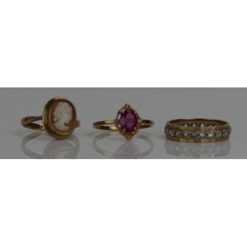 124 - Three 9ct Gold Gem Set Rings including an a CZ eternity (size  N, stamped 9CT, 2.29g), synthetic rub... 