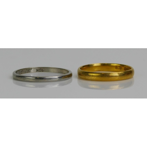 131 - A 22 K Gold Plain Wedding Band (size M.5, London hallmarks, 2.74g) and a 10K white gold plain weddin... 