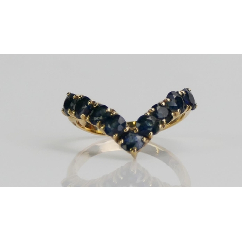 141 - A 9ct Gold and Sapphire Dress Ring, size K.5, stamped 9CT, 2.73g