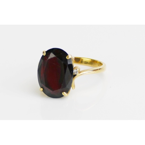 166 - An 18K Gold and Garnet Ring, 15.4x11.5mm stone, size O.5, stamped 18K 750, 5.29g