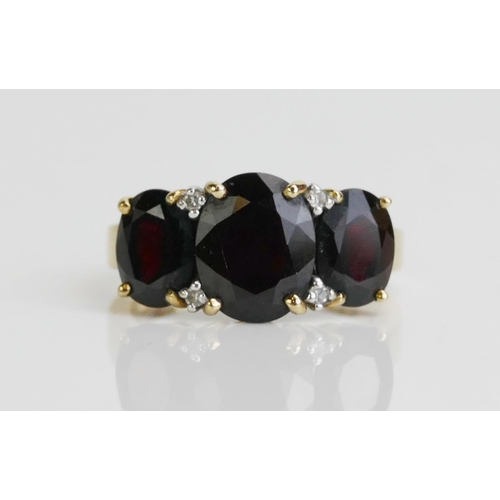 172 - A 9ct Gold, Garnet and Diamond Ring, 10x7.9mm principal stone, size M.5, hallmarked, 4.21g