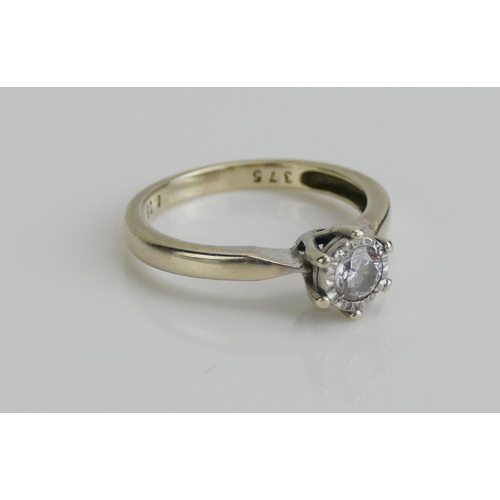 260 - A 9ct White Gold and Diamond Solitaire Ring, the illusion set brilliant cut stone weighing .25ctt, s... 