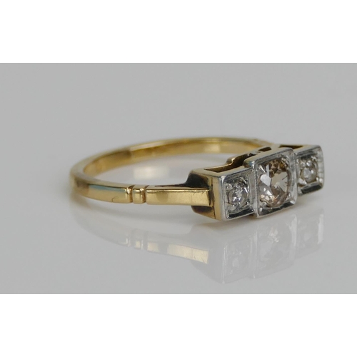 34 - An Old Cut Diamond Three Stone Ring, in a high carat precious yellow metal setting, c. 4.57mm centra... 