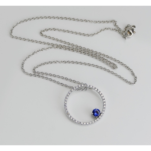 37 - An 18ct White Gold, Tanzanite and Diamond Pendant on chain, 23.9mm pendant etched 0.63 for total dia... 