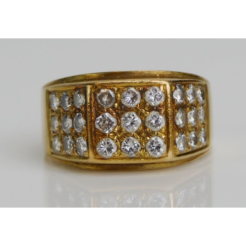 41 - An 18ct Gold and Diamond Ring, set with 2.3mm brilliant cuts arranged in three panels of nine, size ... 