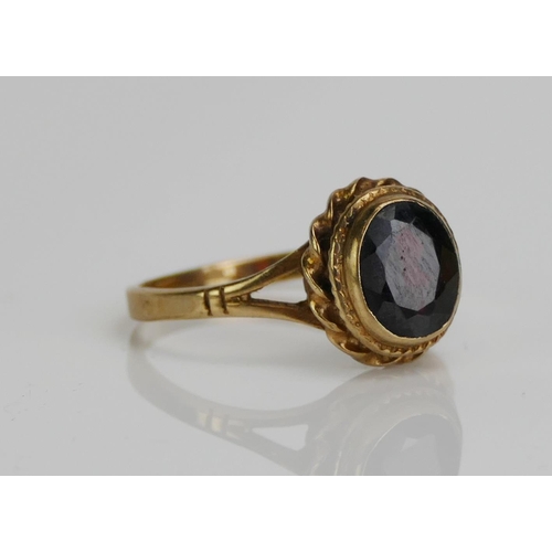 55 - A 9ct Gold and Garnet Dress Ring, c. 13.7x6.9mm principal stone, size S.25, hallmarked, 3.35g