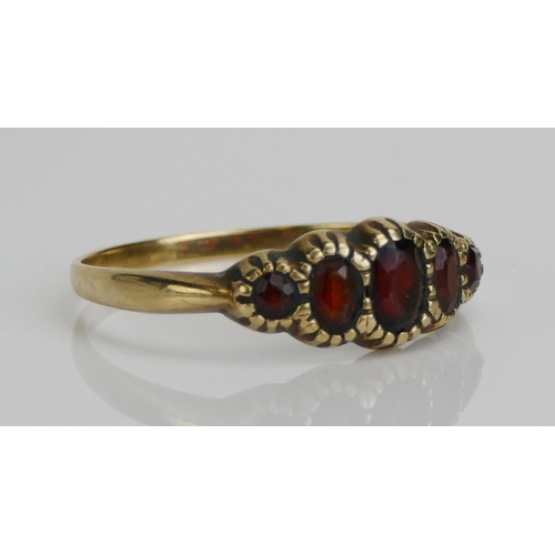 60 - A 9ct Gold and Garnet Five Stone Ring, size Y, hallmarked, 2.45g