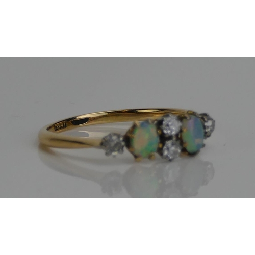 61 - An Antique 18ct Gold, Opal and Old Cut Diamond Six Stone Ring, c. 4.3x3.6mm opals, size M.5, stamped... 